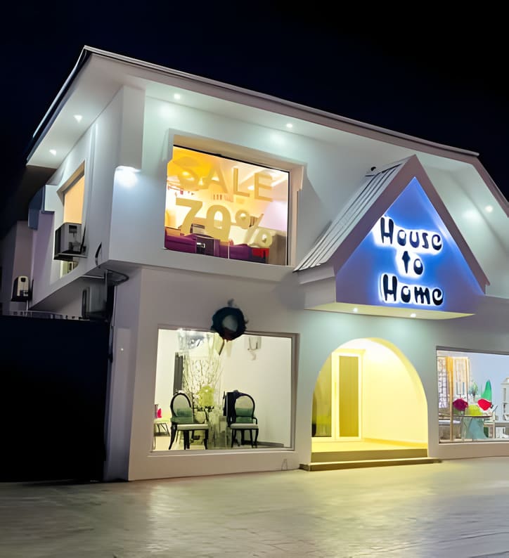 Finished House to Home storefront with illuminated display windows — Admiralty Road, Lekki, Lagos