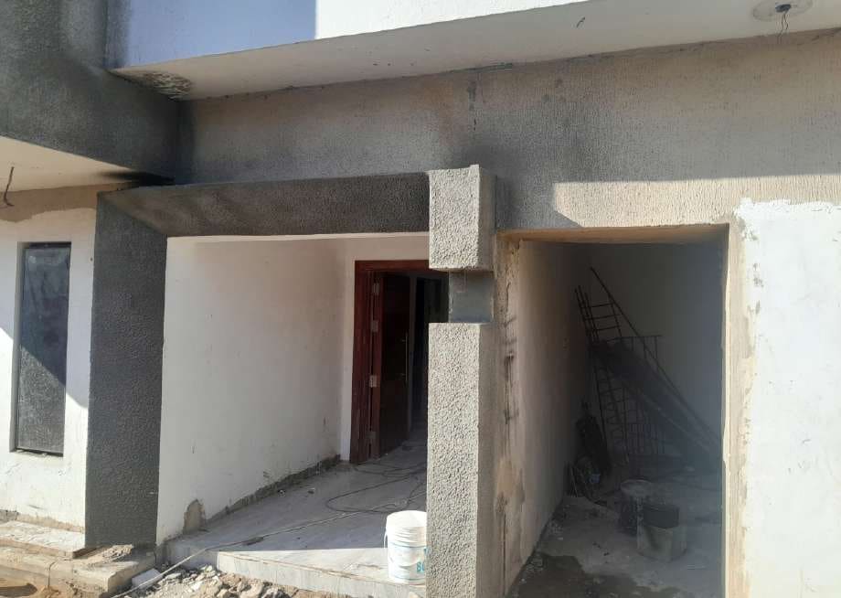 After: plastered entrance and ground-floor openings — Alapere, Lagos