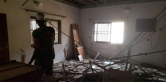 Before: stripped interior with debris and exposed supports — Alapere, Lagos