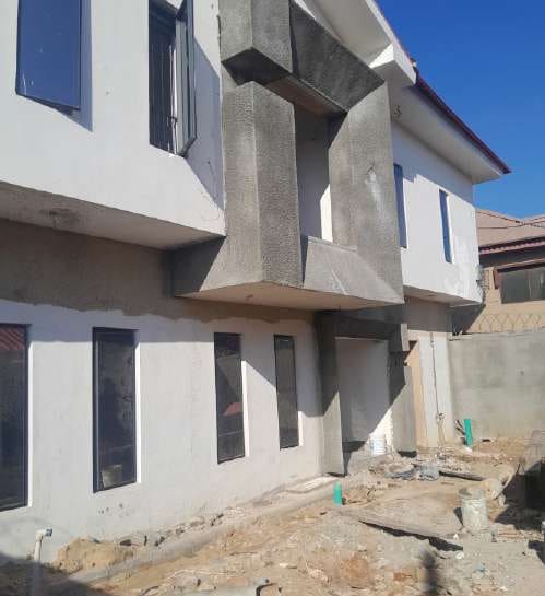 After: remodelled side elevation and projecting facade — Alapere, Lagos