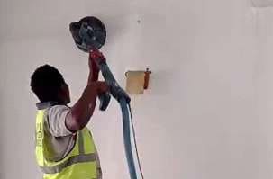 Drywall sander used on an interior wall