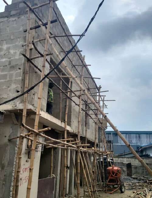 Bamboo scaffolding along the side elevation — Gbagada, Lagos