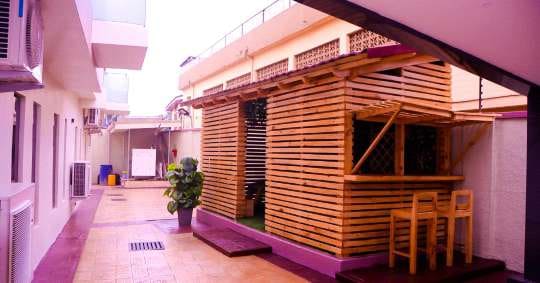 Timber gazebo in the residential courtyard — Gbagada, Lagos