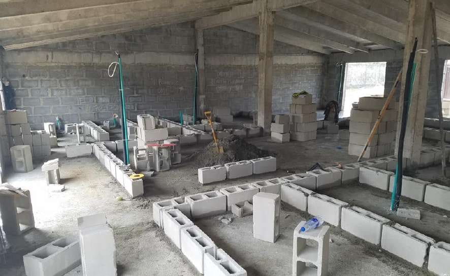 Blockwork partitions being built inside the branch — HFP Shopping Complex, Lagos