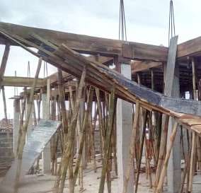 Timber formwork props beneath the upper floor — Lakeview Park, Lekki, Lagos