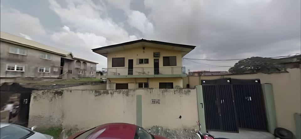 Before: original office facade and perimeter wall — Oluwaleimu Street, Ikeja, Lagos